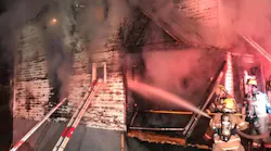 A Roanoke, VA, firefighter was injured by debris from a structure collapse during a residential blaze Saturday.