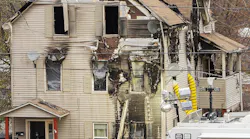 Investigators work Nov. 14, 2019, at the scene of a residential fire that claimed the life of Worcester, MA, Fire Lt. Jason Menard.
