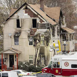 Investigators work Nov. 14, 2019, at the scene of a residential fire that claimed the life of Worcester, MA, Fire Lt. Jason Menard.
