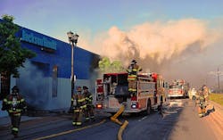 Firefighters in St. Paul, MN, battle one of dozens of arson fire following unrest in the city in May. The IAFC suggests the use of situational awareness in all responses during acts of unrest.