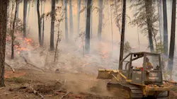 A dozer works to slow the fire near Ruth earlier this week.