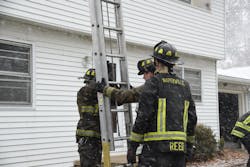 Because the surface of the ground where a ladder is positioned during cold-weather firefighting can become icy and slick, additional steps to secure ground ladders to the building might be necessary.
