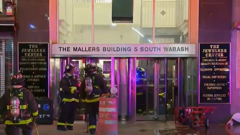 Two Chicago firefighters suffered from heat exhaustion while battling an extra-alarm blaze that broke out on the 10th floor of a 22-story commercial building in the Loop early Thursday.