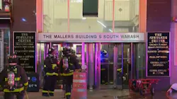 Two Chicago firefighters suffered from heat exhaustion while battling an extra-alarm blaze that broke out on the 10th floor of a 22-story commercial building in the Loop early Thursday.