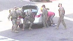 A group of Washington, D.C., Marines helped save a woman who was struck by and pinned beneath a car in an accident near the Marines Barracks on Nov. 7.