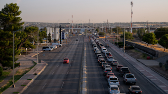 Thousands of vehicles wait to cross into the United States after sunrise in Ju&aacute;rez, Mexico, in September.