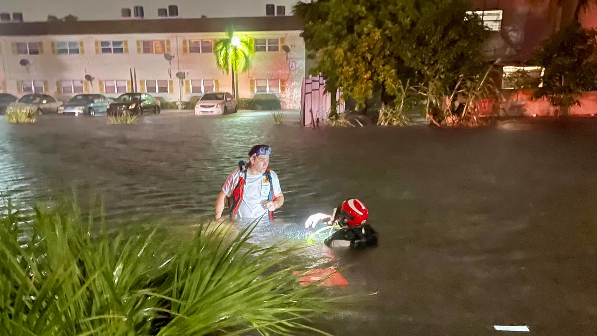 Lauderhill, FL, firefighters rescued a man from a vehicle that was submerged in a canal that merged with roads because of high flood waters Sunday.