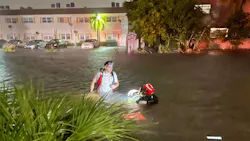 Lauderhill, FL, firefighters rescued a man from a vehicle that was submerged in a canal that merged with roads because of high flood waters Sunday.