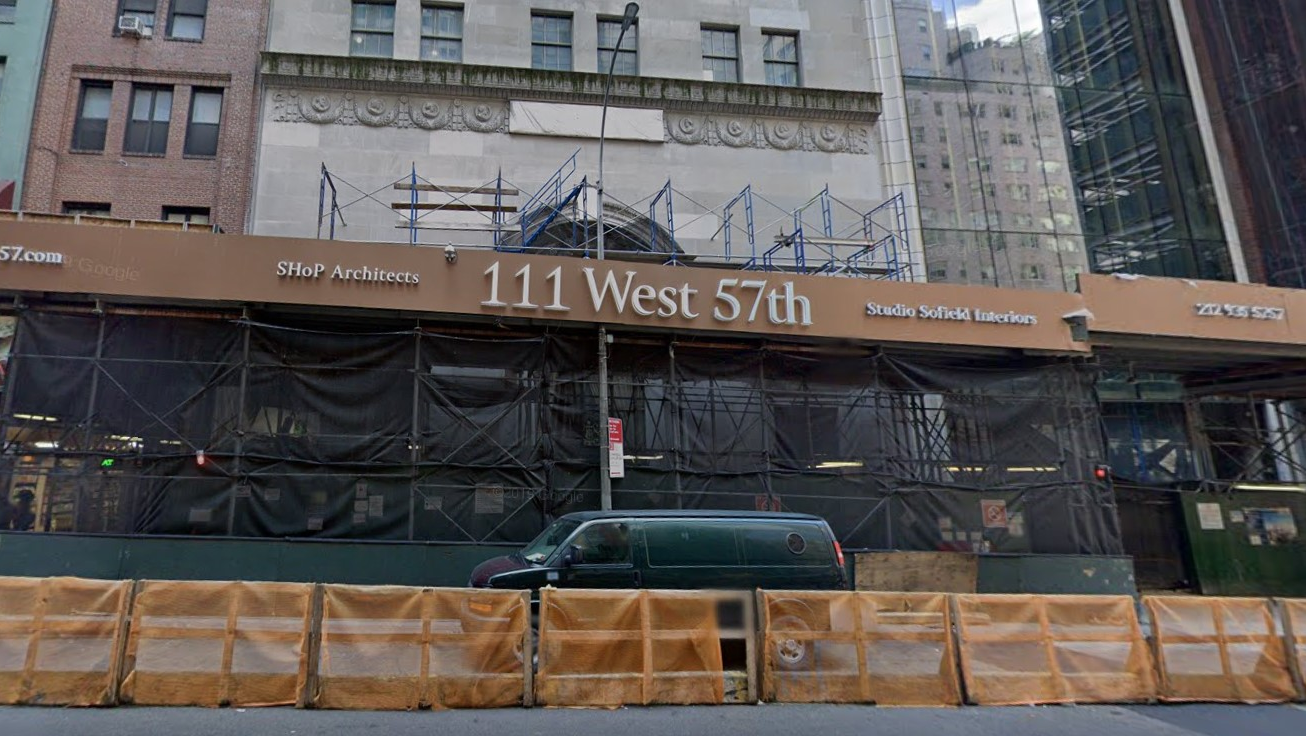Strong wind gusts sent glass and debris from a luxury residential high-rise in Midtown Manhattan showering to the street below late Sunday after the remnants of Hurricane Zeta caused an attached crane to spin in circles last month.