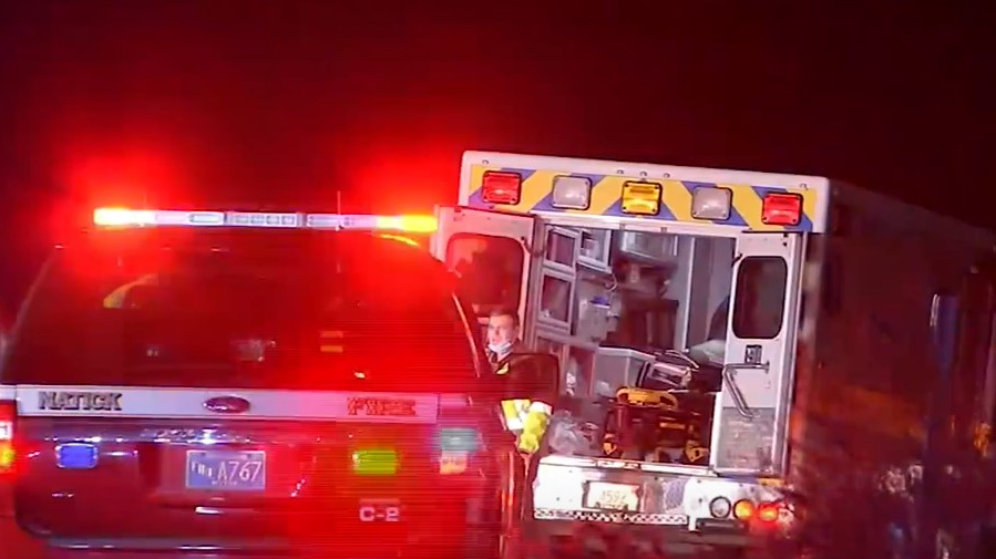 A Vital Ambulance carrying a patient was struck by a car that was speeding in the wrong direction along the Massachusetts Turnpike in Natick early Wednesday.