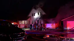 A Rock Island, IL, firefighter was injured in a fall while battling a blaze at a duplex early Monday.