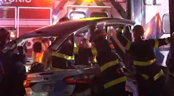A gray sedan crashed into an ambulance sitting at a stop light on San Antonio's north side Wednesday, injuring both drivers and an elderly patie