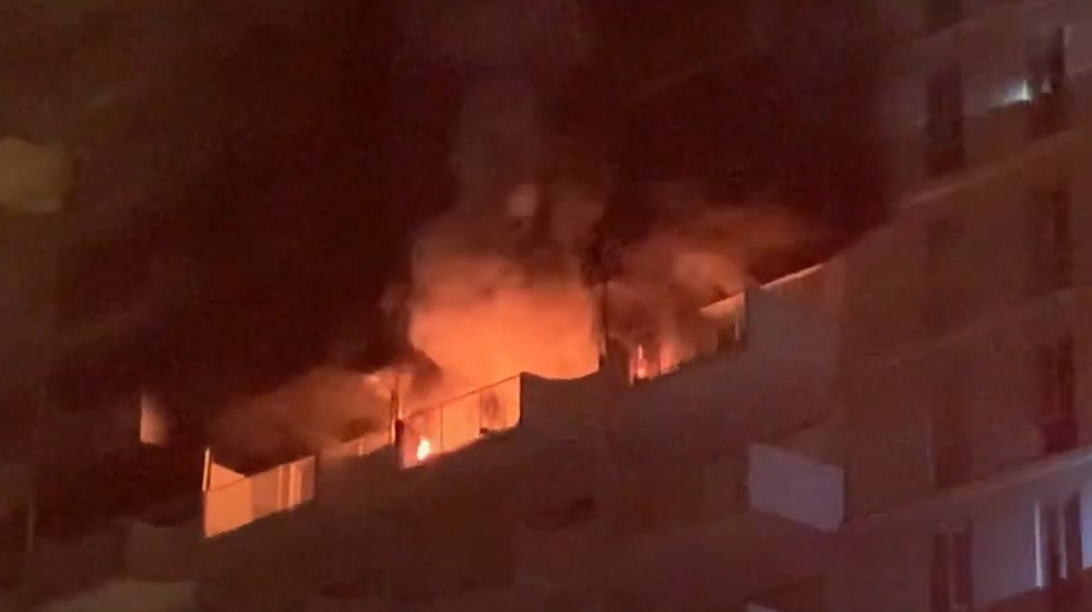 A three-alarm fire broke out on the 11th floor of an apartment building in San Francisco's Financial District early Friday.