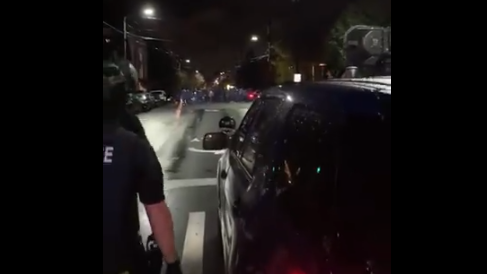 Seattle police move toward protesters in the city's Capitol Hill area late Wednesday.