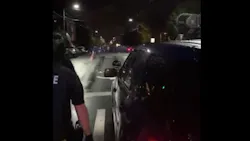 Seattle police move toward protesters in the city's Capitol Hill area late Wednesday.