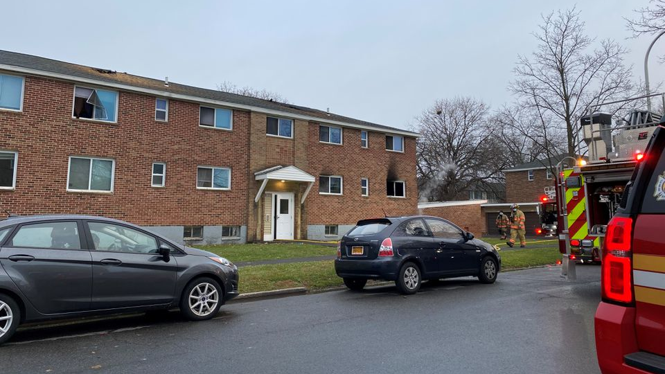 A fire damaged part of the Grant Village Apartments complex early Tuesday in the Eastwood neighborhood of Syracuse, NY.