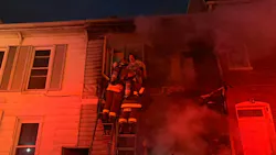 York City, PA, firefighters rescued two people and a dog who were trapped after two homes caught fire early Monday. York City, PA, firefighters rescued two people and a dog who were trapped after two homes caught fire early Monday.