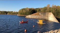 A Greenville County water rescue team works to save a man from the waters of Lake Robinson near Greer, SC, as his overturned catamaran inches dangerously close to a dam and a 25-foot drop. A Greenville County water rescue team works to save a man from the waters of Lake Robinson near Greer, SC, as his overturned catamaran inches dangerously close to a dam and a 25-foot drop.