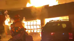 A Stamford, CT, firefighter suffered minor injuries while battling a blaze that broke out at a large garage early Sunday.