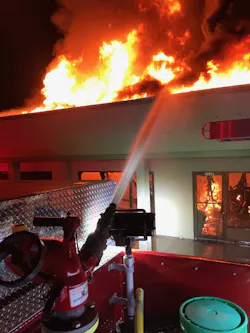 The fire destroyed one shop and damaged several others.