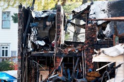 The fire started in an apartment building and spread to two adjacent homes. The fire started in an apartment building and spread to two adjacent homes.