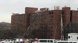 Firefighters from multiple departments battled a challenging fire on the top floor of an apartment high-rise in Albany, NY, on Wednesday.