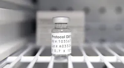 A sterile vial of AstraZeneca Phase III trial COVID-19 vaccine sits in a refrigerator at the Prism Health North Texas location in Oak Cliff on Thursday. The clinic administers the vaccine to non-COVID patients participating in the trial study.