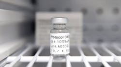 A sterile vial of AstraZeneca Phase III trial COVID-19 vaccine sits in a refrigerator at the Prism Health North Texas location in Oak Cliff.