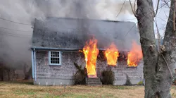 Dartmouth, MA, Fire District 2 firefighters rescued an unconscious woman from a burning two-story home Monday.