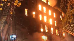 More than 100 FDNY firefighters battled a massive blaze that tore through a vacant five-story building and a historic church early Saturday.