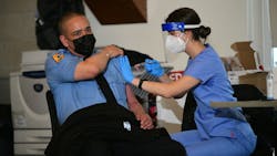 FDNY EMT Edwin Mendez is one of 450 members of the department to receive the COVID-19 vaccine Wednesday. FDNY EMT Edwin Mendez is one of 450 members of the department to receive the COVID-19 vaccine Wednesday.