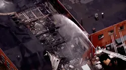 Englewood, NJ, firefighters battled a five-alarm blaze that ripped through a building Wednesday.