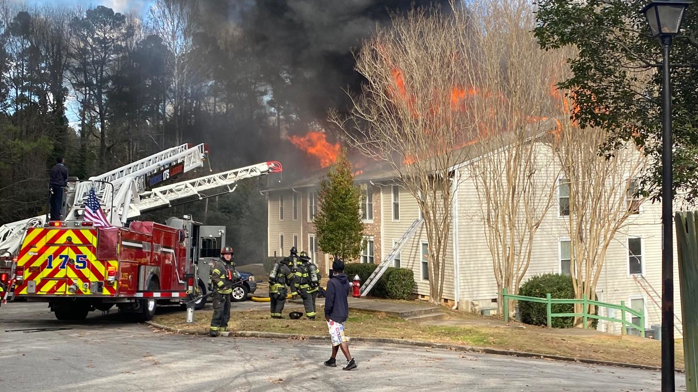 A mother dropped her two children out of a third-story window to escape a burning apartment in Irmo, SC, on Wednesday.