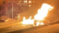 FDNY firefighters battled a two-alarm fire that erupted early Tuesday when a flatbed truck hauling propane tanks overturned along the Long Island Expressway in Queens.