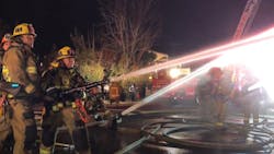 More than 100 Los Angeles City firefighters battled a fire that spread to two commercial buildings and collapsed the roof of one of the structures Monday. More than 100 Los Angeles City firefighters battled a fire that spread to two commercial buildings and collapsed the roof of one of the structures Monday.