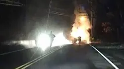 Dashboard camera video shows a Monroe police officer and a deputy fire chief saving a driver from a fiery crash on Thanksgiving.