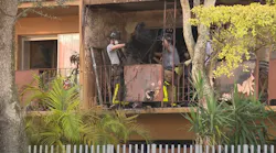 More than 90 Miami-Dade firefighters battled a fire that broke out at a North Miami apartment building and injured four people Saturday.
