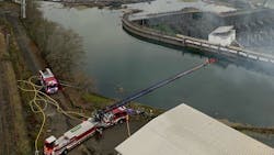 Clackamas, OR, Fire District #1 firefighters used aerials to battle a fire the tore through the closed Blue Heron paper mill in Oregon City on Saturday. Clackamas, OR, Fire District #1 firefighters used aerials to battle a fire the tore through the closed Blue Heron paper mill in Oregon City on Saturday.