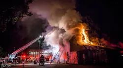 A Santa Cruz, CA, firefighter and a civilian were injured when a boarded-up, former recovery center building caught fire early Wednesday, killing one person.