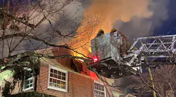 Around 60 Montgomery County, MD, firefighters battled a massive fire that broke out at an unoccupied house in Silver Spring early Tuesday.