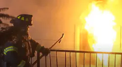 Dozens of firefighters from multiple departments battled a three-alarm fire at a Skyway, WA, early Wednesday.