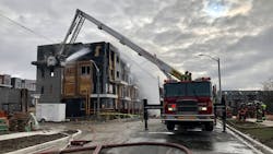 Toronto firefighters battled a difficult three-alarm fire for nearly three hours Saturday, and the blaze damaged several vacant townhouses near the city's Downsview Park/ Toronto firefighters battled a difficult three-alarm fire for nearly three hours Saturday, and the blaze damaged several vacant townhouses near the city's Downsview Park/