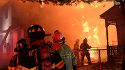 Rochester firefighters assess the scene following the collapse of the wall at the Wilson Street home. Rochester firefighters assess the scene following the collapse of the wall at the Wilson Street home.