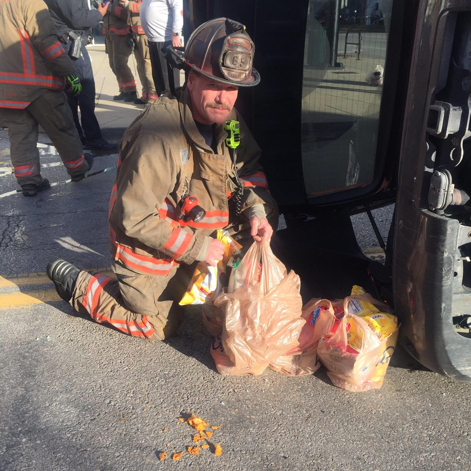 After Cincinnati firefighters rescued a woman following a crash, several of them collected her groceries and delivered them to her apartment Wednesday.