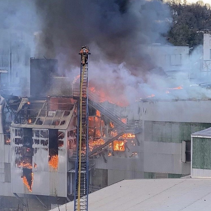Clackamas, OR, Fire District #1 firefighters used aerials to battle a fire the tore through the closed Blue Heron paper mill in Oregon City on Saturday.