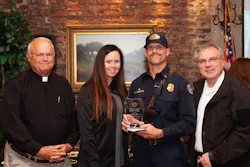 Present at the awards ceremony were (from l.) Chaplain Rob Dewey, Chief Griffin's wife Melissa, Chief Griffin and Fire Chief Dan Curia.