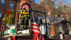 A Boston firefighter holds a girl after she was rescued from the top floor during a two-alarm residential fire in December. A Boston firefighter holds a girl after she was rescued from the top floor during a two-alarm residential fire in December.