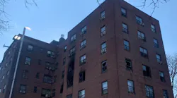 FDNY firefighters braved flames to rescue several crying residents trapped on the fourth floor of a burning seven-story building in the Bronx on Tuesday.