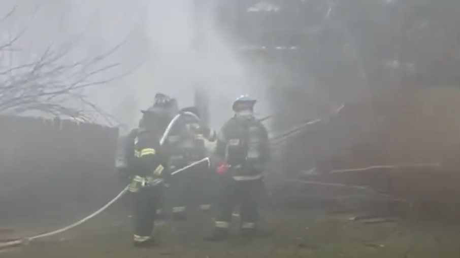 Firefighters work to put out a fire from a small plane that crashed and exploded in the backyard of a Columbia, SC, home Wednesday.