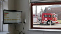 A fire apparatus drives by the Columbus, OH, Division of Fire's new Station 16, which opened Wednesday. The computer monitor seen in the foreground can dispatch firefighters individually by assignment in their dorm rooms without having to wake an entire company if not everyone is needed. A fire apparatus drives by the Columbus, OH, Division of Fire's new Station 16, which opened Wednesday. The computer monitor seen in the foreground can dispatch firefighters individually by assignment in their dorm rooms without having to wake an entire company if not everyone is needed.